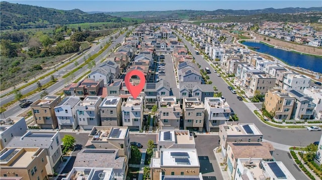 birds eye view of property with a water view and a residential view