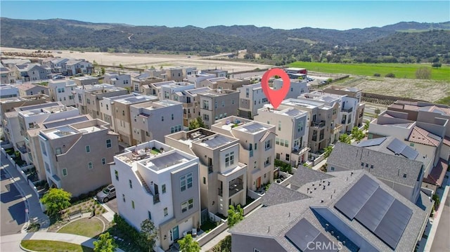 drone / aerial view with a residential view and a mountain view