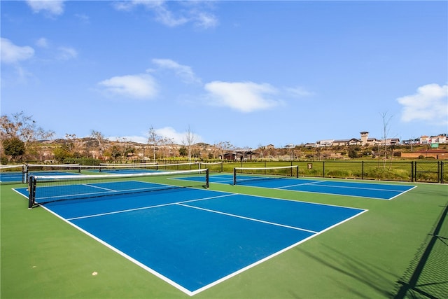 view of sport court with fence