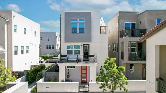 view of front of property featuring a fenced front yard and stucco siding
