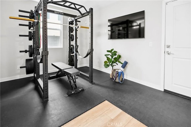 workout room with baseboards