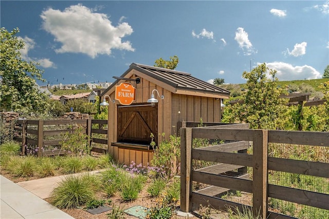 view of shed with fence
