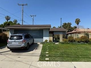 21317 Dolores St, Carson, CA 90745 - view of front of house featuring driveway and a front yard