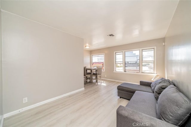 541 Elm Ave, Inglewood, CA 90301 - living area featuring light wood-type flooring, visible vents, and baseboards