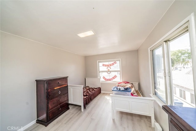 541 Elm Ave, Inglewood, CA 90301 - bedroom with access to outside, baseboards, and light wood-type flooring