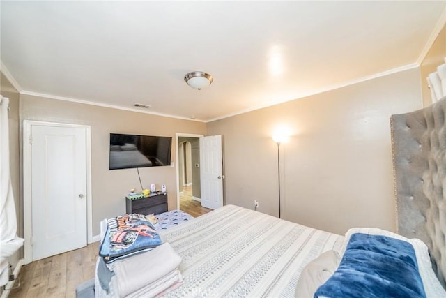 541 Elm Ave, Inglewood, CA 90301 - bedroom featuring visible vents, crown molding, and light wood-style floors