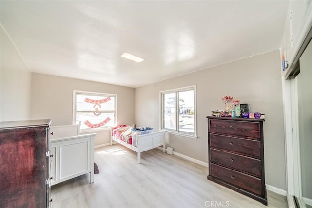 541 Elm Ave, Inglewood, CA 90301 - bedroom with multiple windows, baseboards, and light wood finished floors