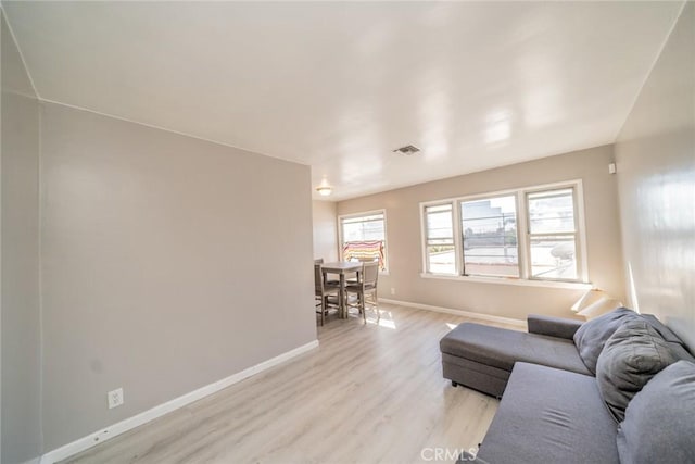 541 Elm Ave, Inglewood, CA 90301 - living room featuring light wood finished floors, visible vents, and baseboards