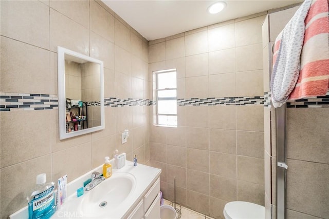 541 Elm Ave, Inglewood, CA 90301 - bathroom featuring toilet, tile walls, and vanity