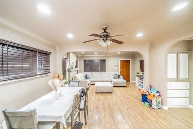 541 Elm Ave, Inglewood, CA 90301 - living room featuring recessed lighting, arched walkways, light wood-style flooring, and a ceiling fan