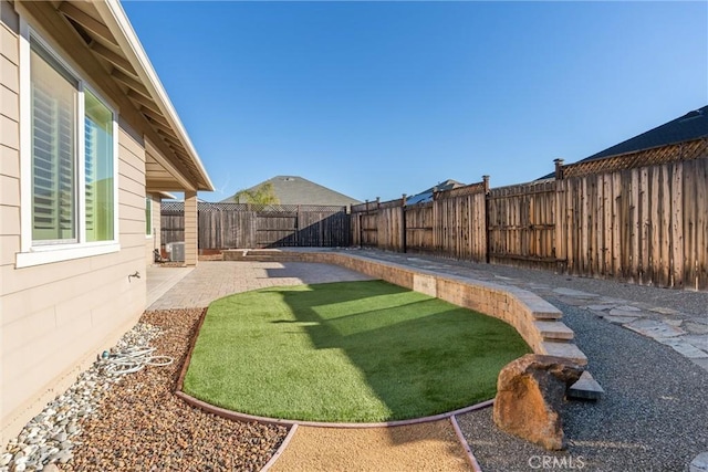view of yard featuring a fenced backyard and a patio area