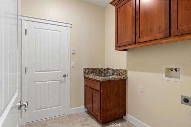 clothes washing area featuring a sink, light tile patterned flooring, electric dryer hookup, cabinet space, and washer hookup