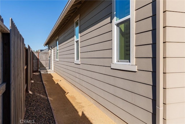 view of property exterior with fence