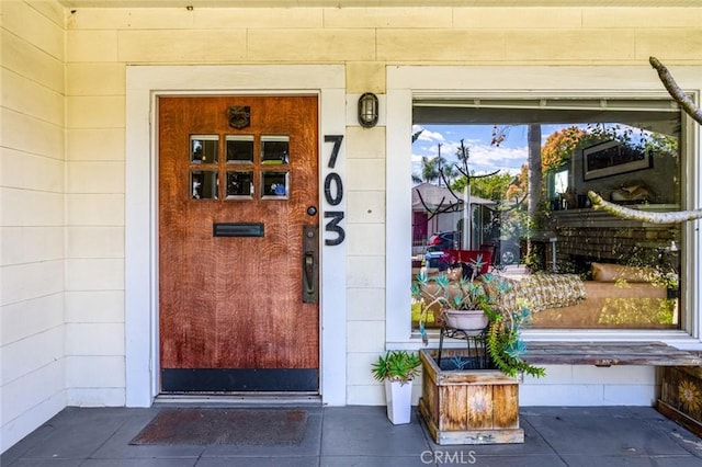 property entrance with concrete block siding