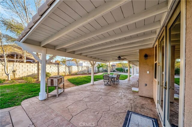 view of patio / terrace featuring outdoor dining area, french doors, and a fenced backyard