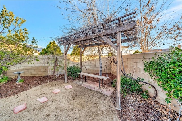 view of yard featuring a patio area, a pergola, and a fenced backyard