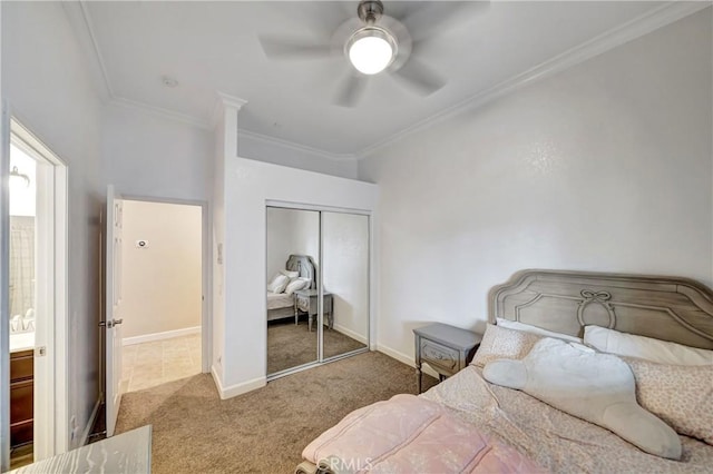 bedroom with a closet, ceiling fan, crown molding, carpet, and baseboards