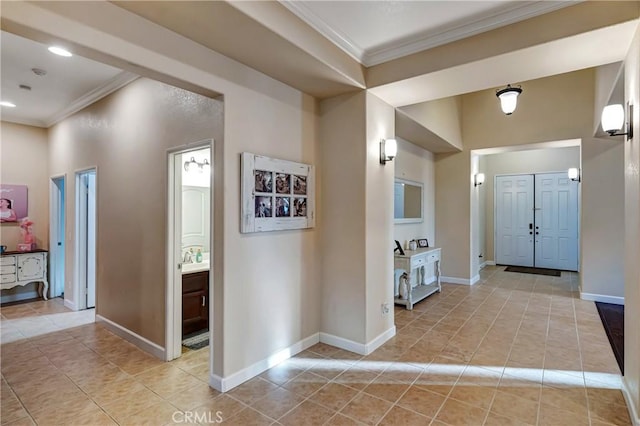 hallway with baseboards, recessed lighting, light tile patterned floors, and crown molding