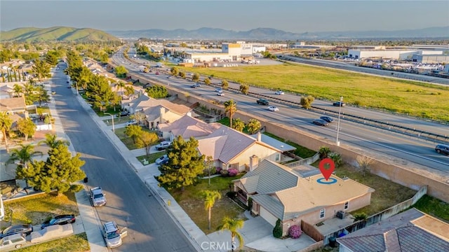 drone / aerial view featuring a mountain view
