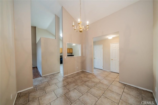 unfurnished room featuring baseboards, high vaulted ceiling, a chandelier, and light tile patterned flooring