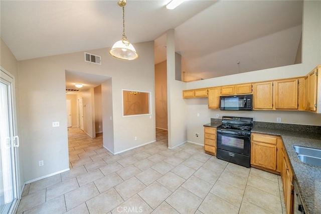 kitchen featuring visible vents, decorative light fixtures, a sink, dark countertops, and black appliances