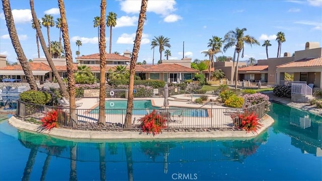 233 Lake Shore Dr, Rancho Mirage, CA 92270 - community pool with fence and a patio