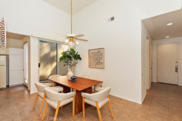 233 Lake Shore Dr, Rancho Mirage, CA 92270 - dining area featuring ceiling fan, recessed lighting, a towering ceiling, light tile patterned floors, and baseboards