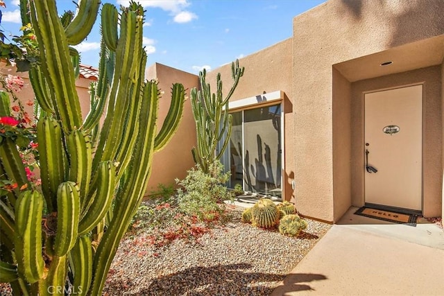 233 Lake Shore Dr, Rancho Mirage, CA 92270 - entrance to property featuring stucco siding