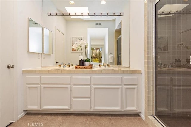 233 Lake Shore Dr, Rancho Mirage, CA 92270 - full bathroom with a stall shower, tile patterned floors, recessed lighting, and double vanity