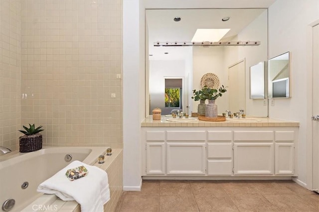 233 Lake Shore Dr, Rancho Mirage, CA 92270 - bathroom with a whirlpool tub, tile patterned floors, double vanity, a skylight, and baseboards