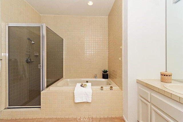 233 Lake Shore Dr, Rancho Mirage, CA 92270 - bathroom featuring a bath, a shower stall, vanity, and recessed lighting