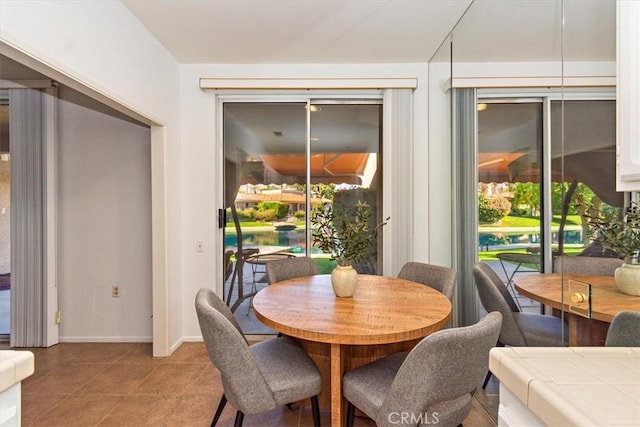 233 Lake Shore Dr, Rancho Mirage, CA 92270 - dining room featuring baseboards and light tile patterned floors