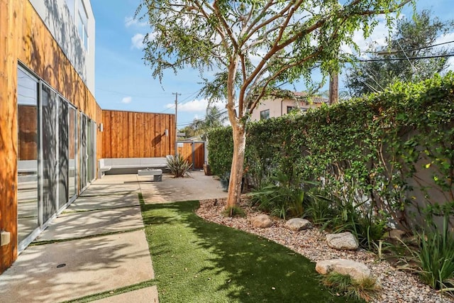 view of yard featuring a patio and a fenced backyard