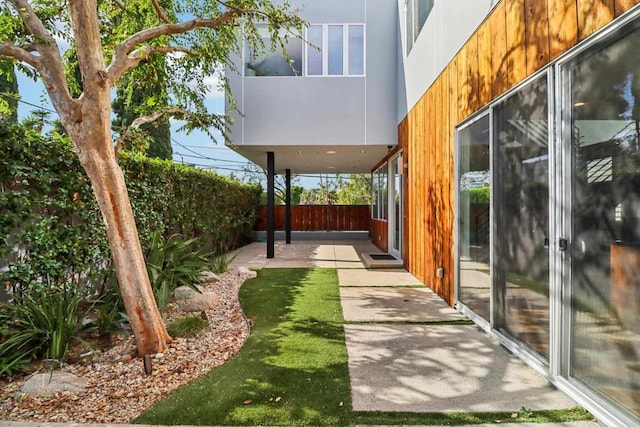 view of yard with a fenced backyard and a patio area