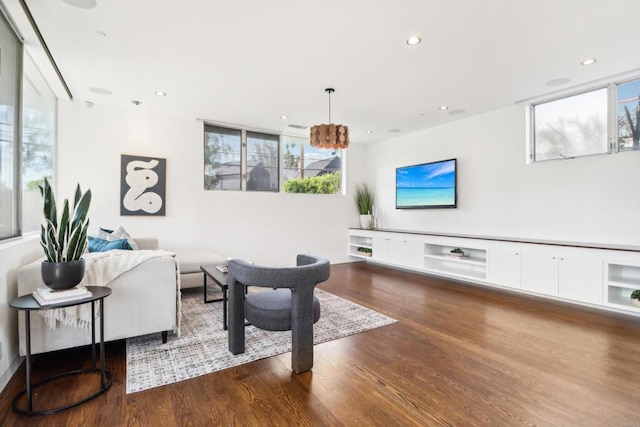 living room with recessed lighting and wood finished floors