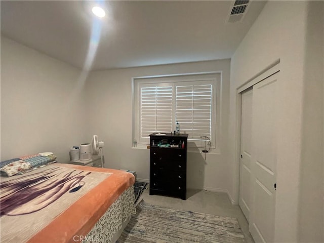 bedroom with carpet flooring, a closet, and baseboards