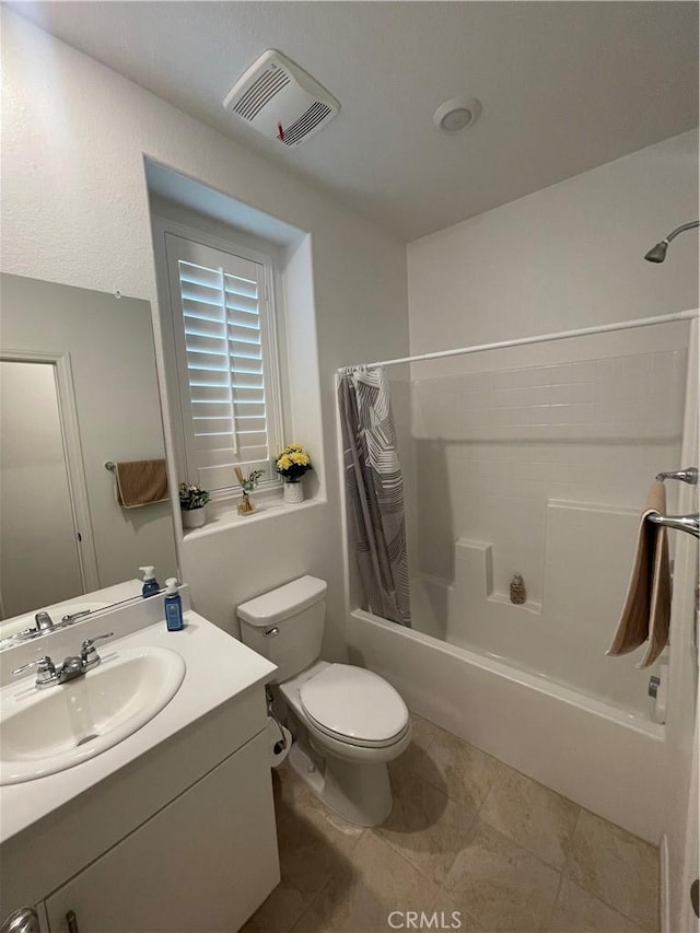 full bathroom with shower / bath combo, toilet, vanity, and tile patterned flooring