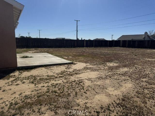 view of yard featuring a fenced backyard and a patio
