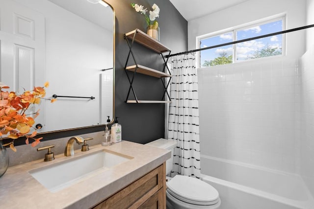 bathroom with shower / tub combo, toilet, and vanity