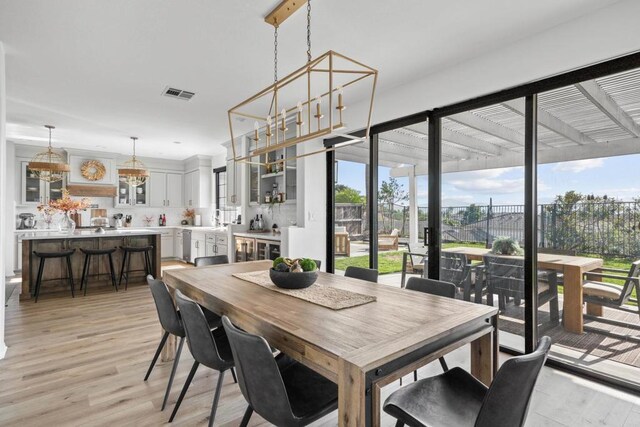 1890 Da Gama Ct, Escondido, CA 92026 - dining area featuring plenty of natural light, light wood-style flooring, and a chandelier