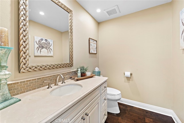 34501 Calle Carmelita, Dana Point, CA 92624 - bathroom featuring tasteful backsplash, toilet, baseboards, visible vents, and wood finished floors