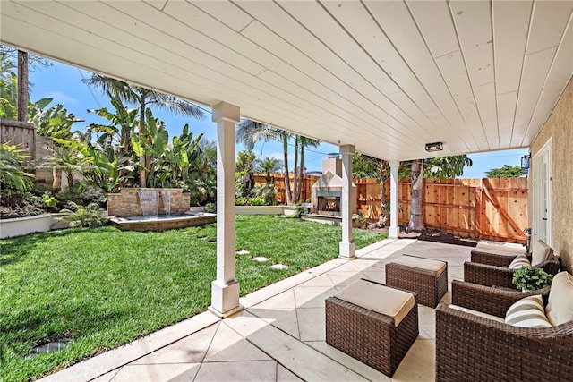 34501 Calle Carmelita, Dana Point, CA 92624 - view of patio with a warm lit fireplace and a fenced backyard
