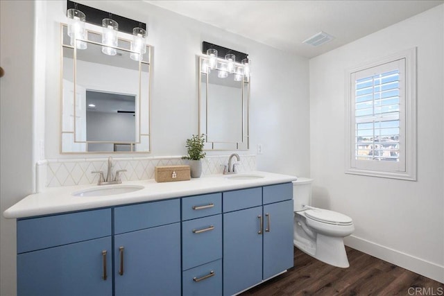 46525 Peach Tree St, Temecula, CA 92592 - full bathroom with double vanity, wood finished floors, and tasteful backsplash