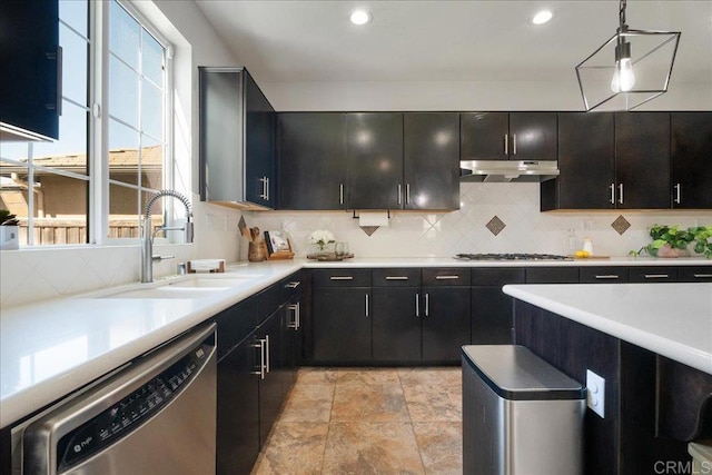 46525 Peach Tree St, Temecula, CA 92592 - kitchen with appliances with stainless steel finishes, under cabinet range hood, decorative backsplash, light countertops, and recessed lighting