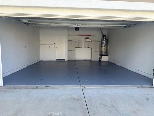 garage featuring secured water heater