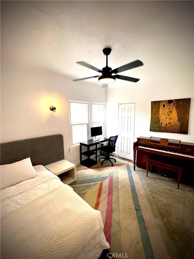 bedroom featuring a ceiling fan and wood finished floors