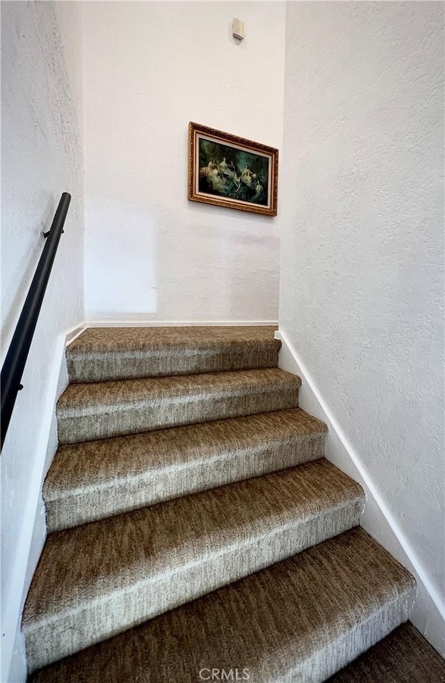 stairs with a textured wall