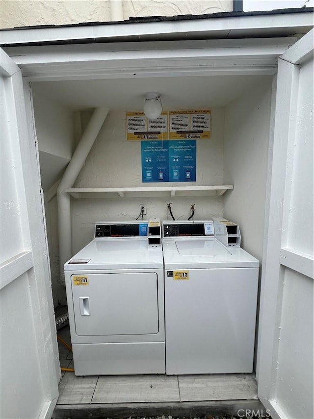 shared laundry area with washing machine and dryer