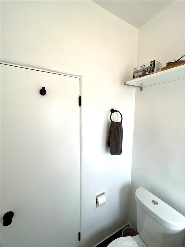 bathroom featuring toilet