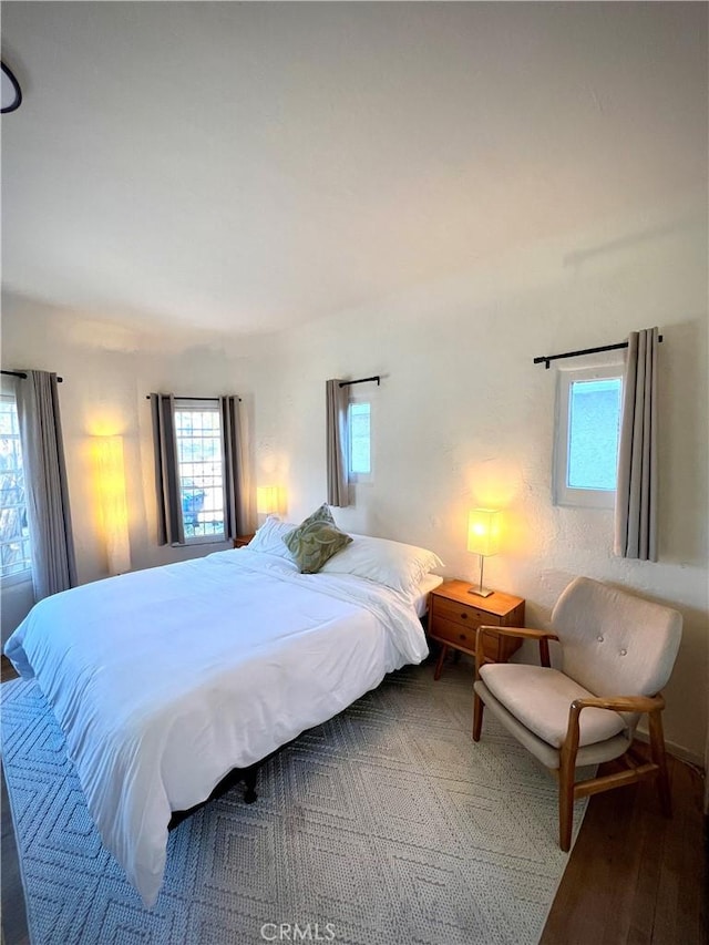 bedroom featuring wood finished floors
